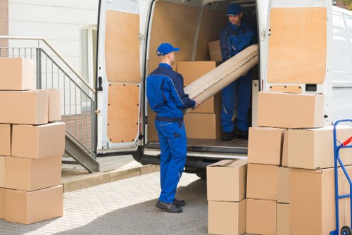 Moving van and removal team outside a Kensington townhouse