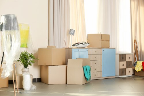 Removal team planning a move in Kensington with boxes and furniture