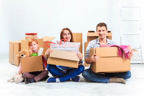Packed moving boxes and protective wrapping for a Kensington home relocation
