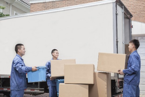 Mover carrying furniture with care through a property