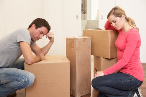 Professional movers handling household items in Kensington