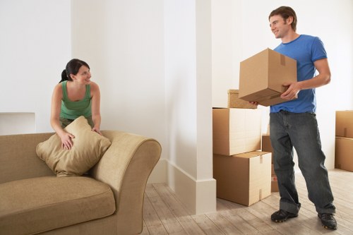 Removalists navigating stairs in a Kensington property